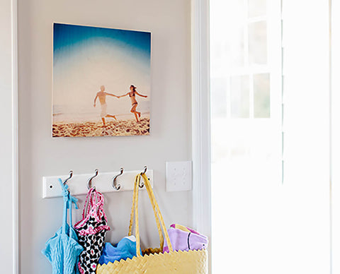 A floatmount wood photo print hanging on a wall, casting a drop shadow.