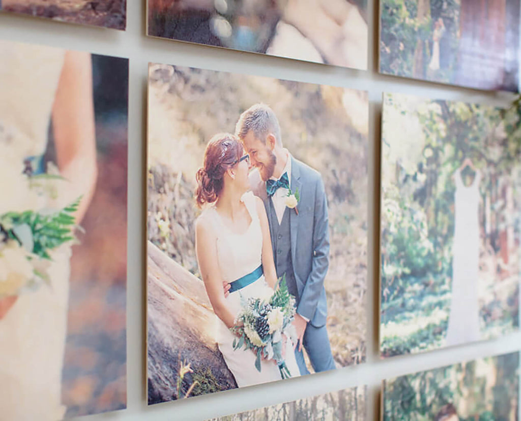 A detailed view of a single floatmount wood photo print hung within a set of prints on a wall.